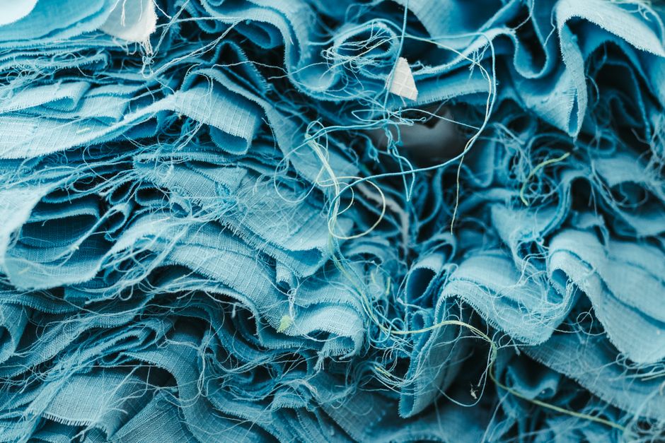 Intricate close-up view of textured blue fabric layers, showcasing detail and texture.